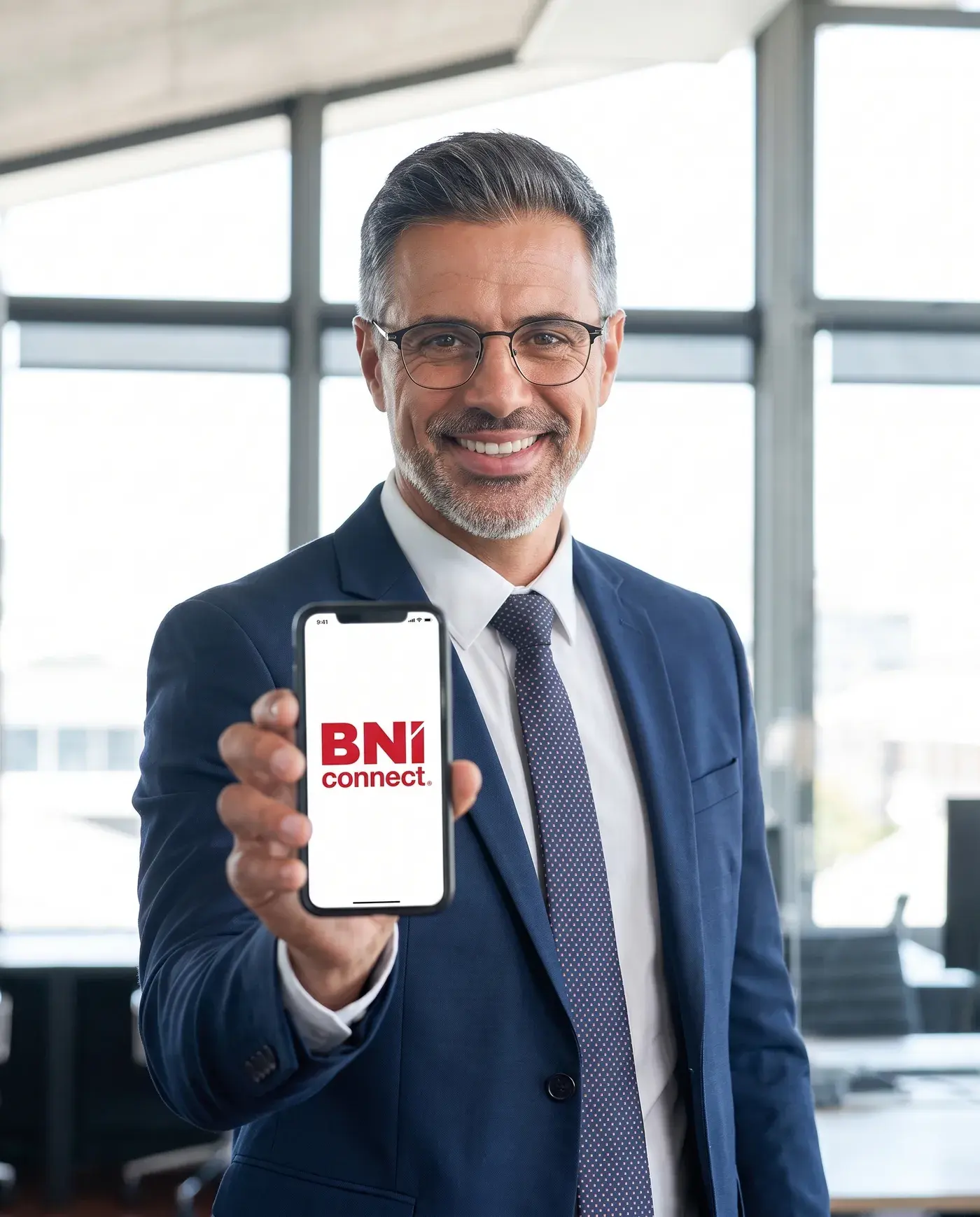 A BNI Member showing a phone with the BNI Connect app open