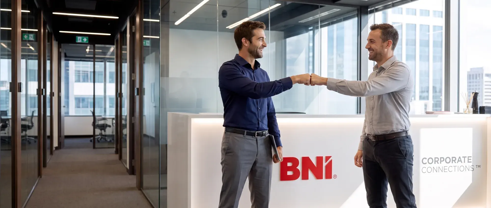 A welcome at the reception desk with the BNI sign