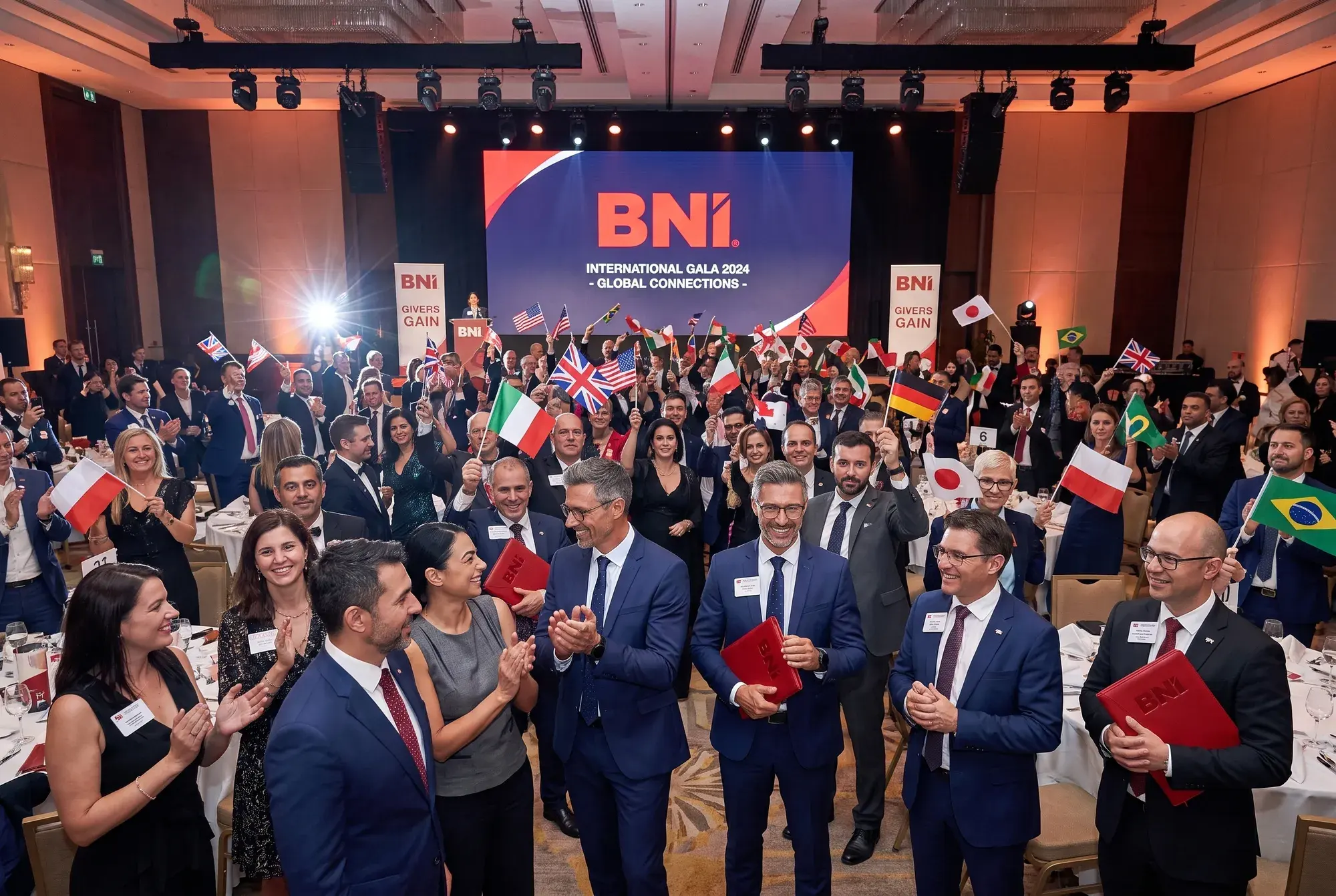 An international BNI gala hall full of participants with flags
